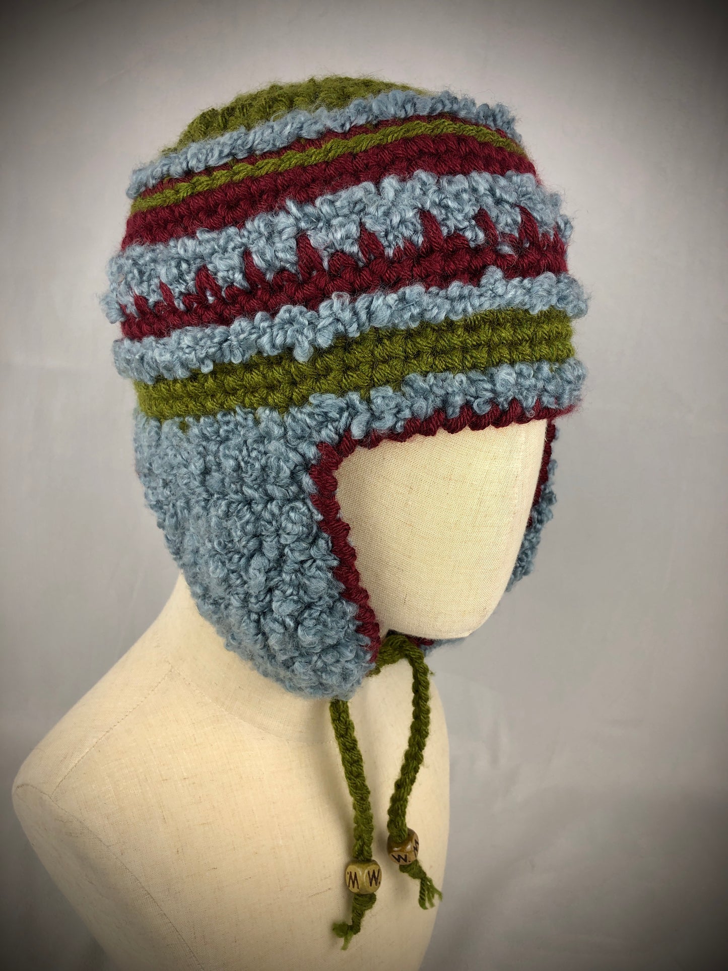 Blue green red stripe earflap hat